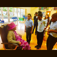 One of the first Black women to arrive last century from Guyana has been telling primary school children in Brixton what it was like to leave her family. 101-year old Olive Gordon was visiting the pupils as part of Black History Month.