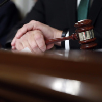 Econs Brush with the Law