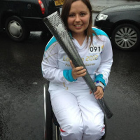 Former Paralympian @Heleneraynsford won a Gold in Beijing and is now carrying the #Paratorch at Tower Hill and tells @annareporting she is carrying the flame in memory of a friend.