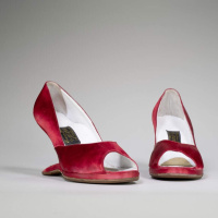 What the Queen of Salsas red satin heels say about America